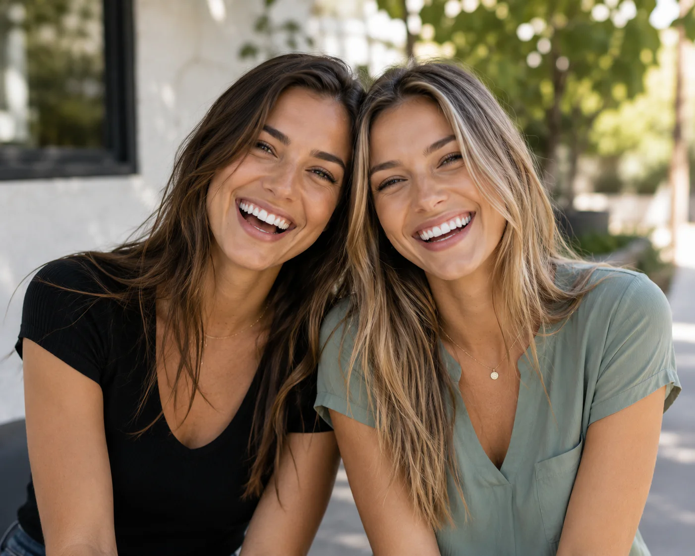 Two women smiling together outdoors