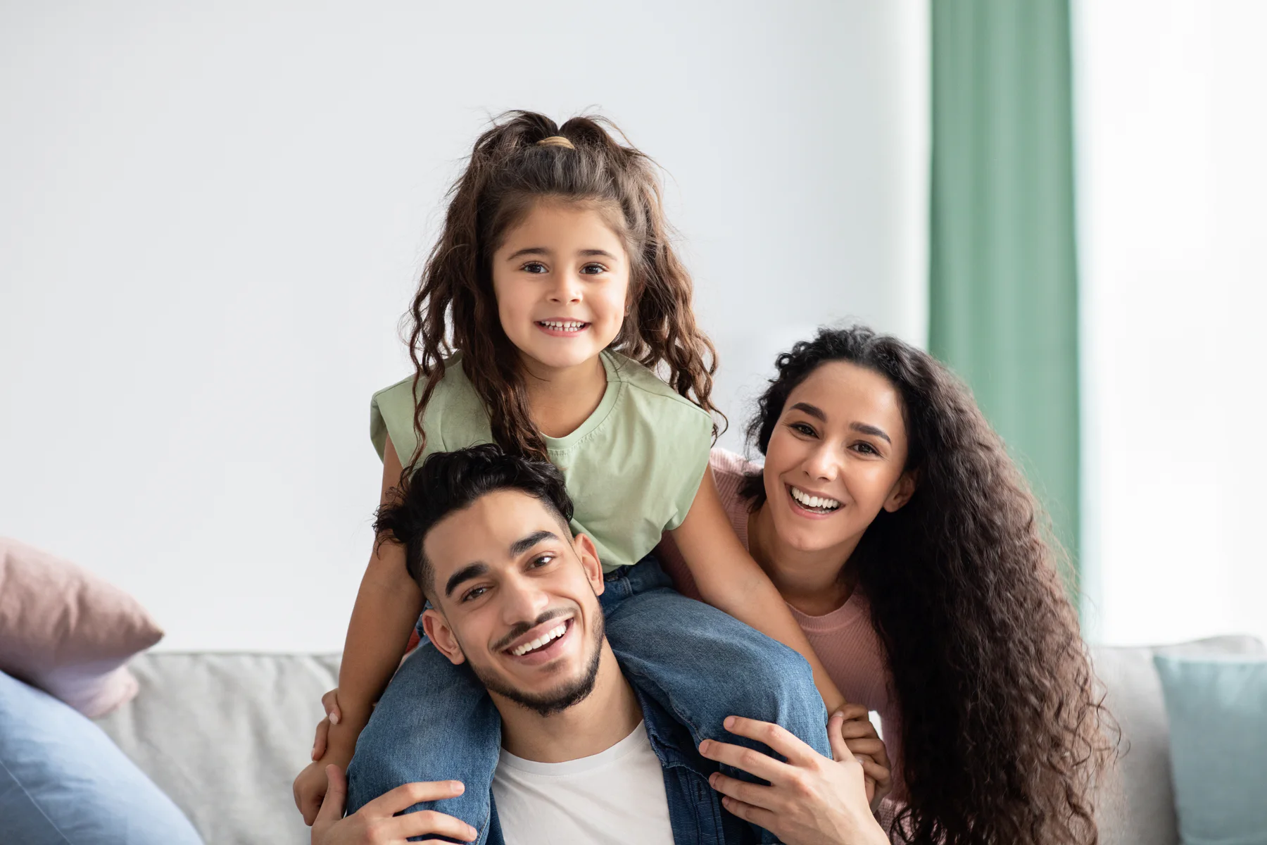 A family smiling together at home