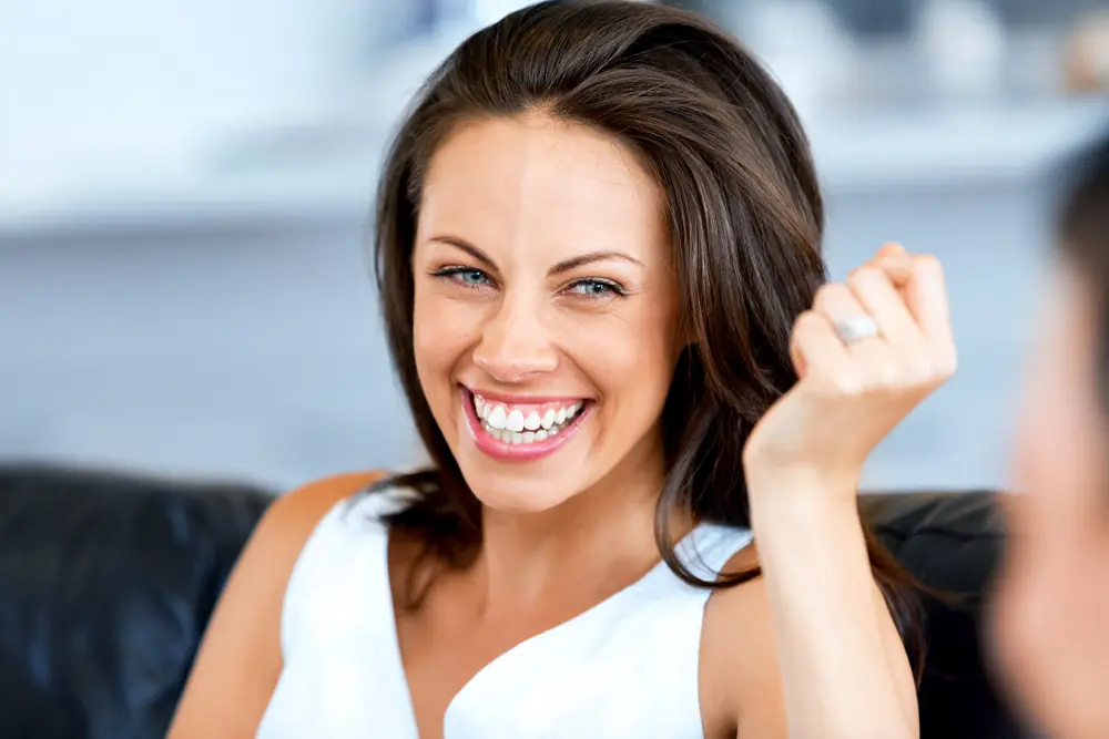 Smiling woman seated in a dental office