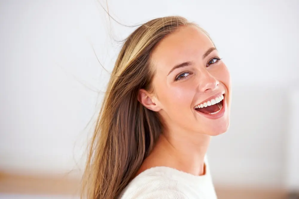 Smiling woman looking over her shoulder