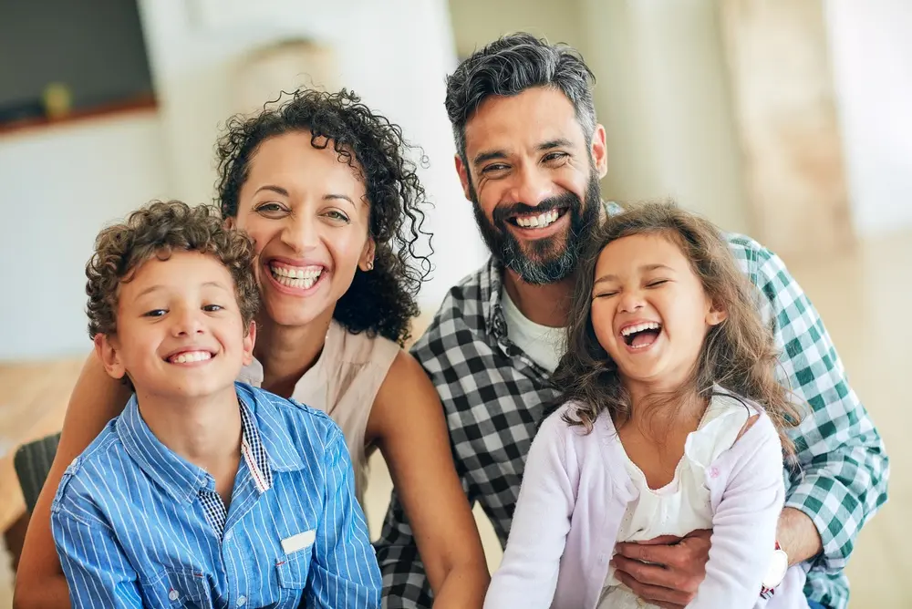 Smiling family of four
